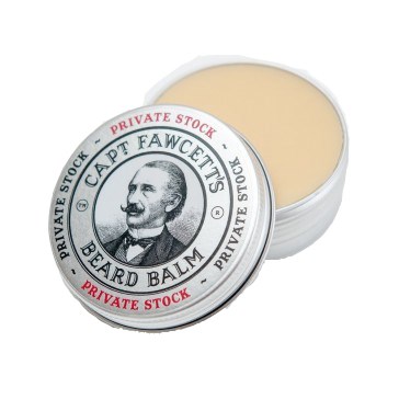 A round container of beard balm with a black and white label featuring a man's portrait and text.