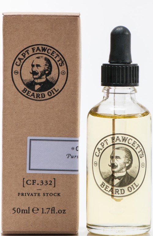 A small glass bottle with beard oil and a brown box with the same logo and text. The bottle has a dropper.