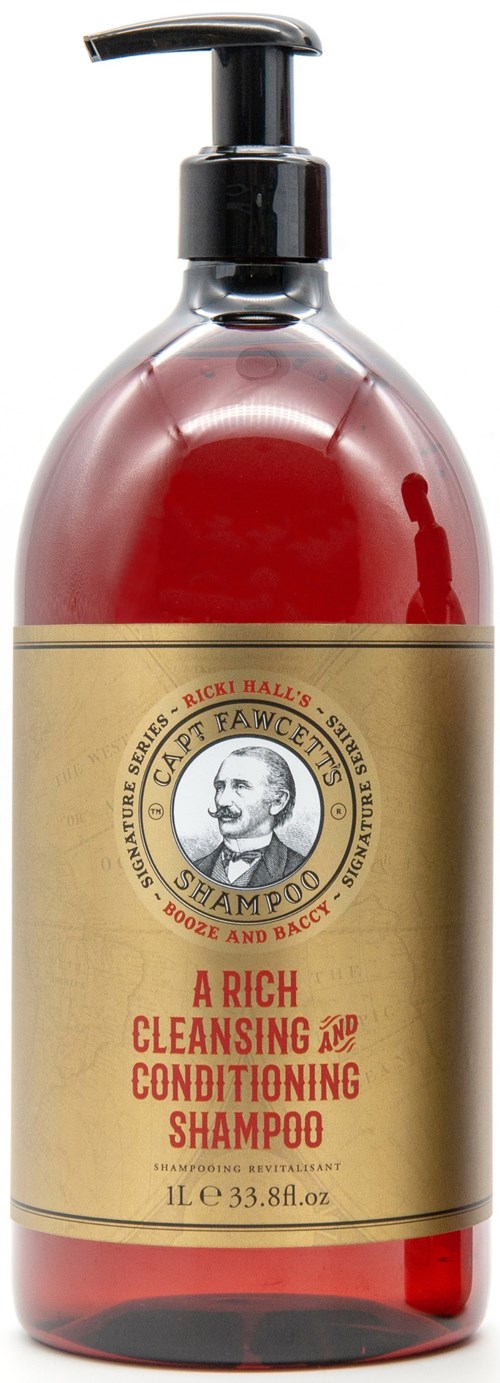 A shampoo bottle with a pump, red liquid inside, and a beige label with a man's portrait and red text.