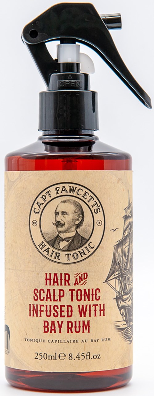En flaska märkt 'Hair and Scalp Tonic' med sprejmunstycke och en vintageetikett med ett manligt ansikte.