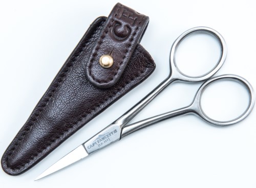 A pair of hair-cutting scissors next to a leather sheath, often used by barbers, on a white background.
