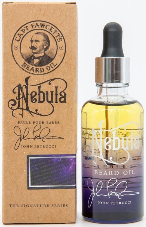 A beard oil bottle with a dropper next to a brown box labeled Nebula, Captain Fawcett, and John Petrucci.
