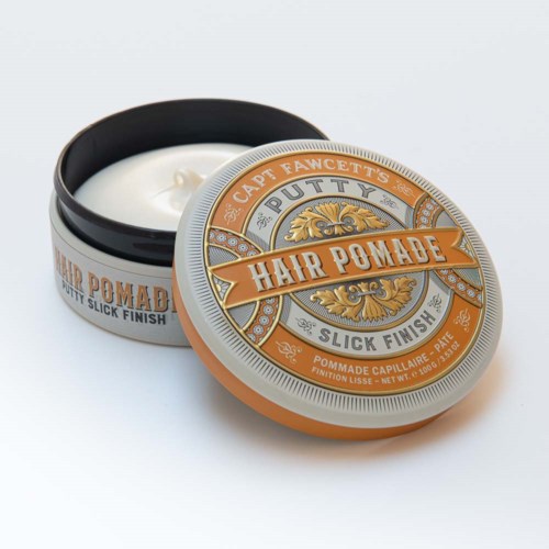 Small round tin container with orange, gray, and white label, containing hair pomade for a slick finish.