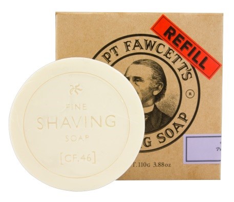 A round white soap labeled 'Fine Shaving Soap' with a cardboard box behind it, marked as a refill.