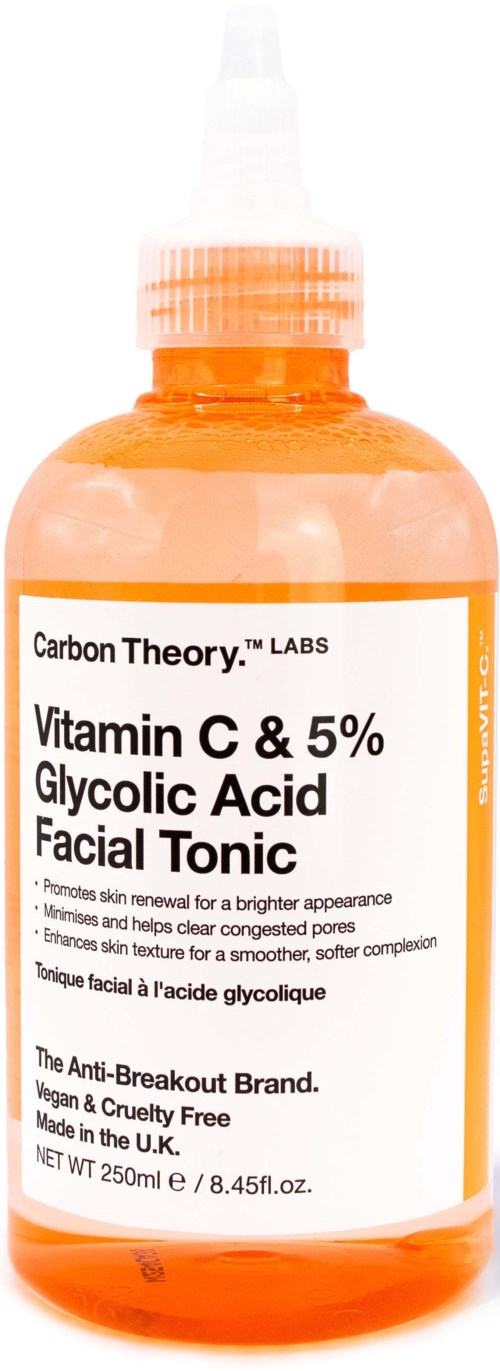 Oranje fles met witte label, bevat vitamine C en glycolzuur gezichts toner, gemaakt in het Verenigd Koninkrijk.