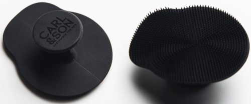 Two black hairbrushes with different bristle styles on a white background.