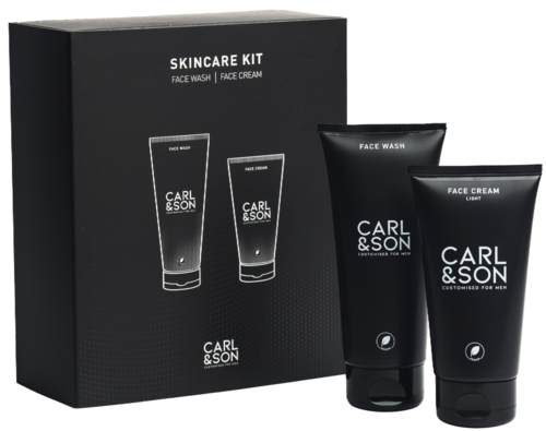 Black box with skincare kit, includes face wash and face cream, two tubes standing next to the box.