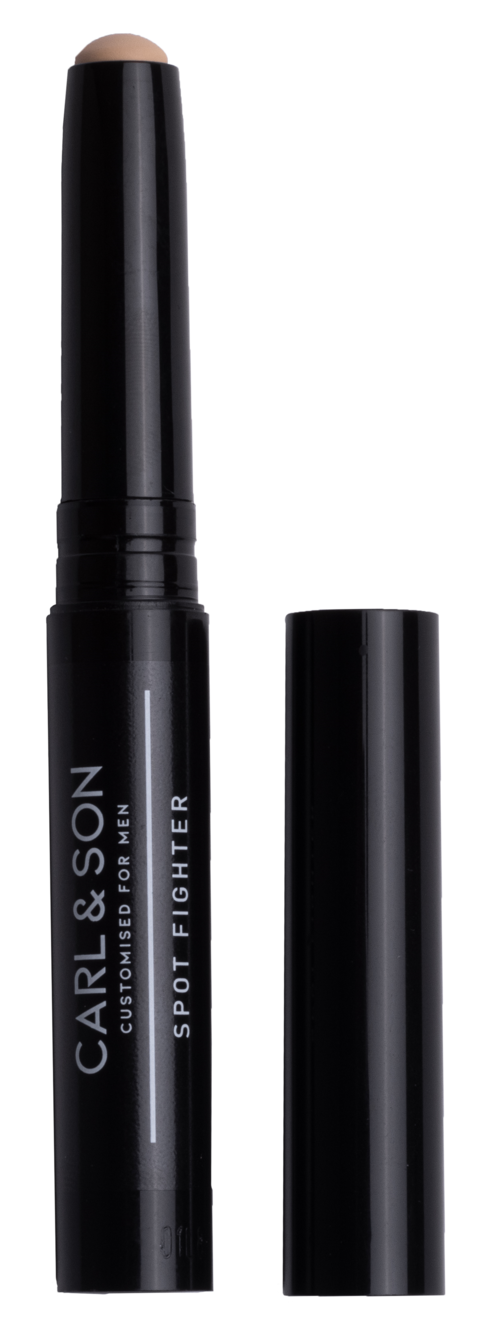 A black cosmetic pen with the words 'CARL & SON' and 'SPOT FIGHTER' on it, with the cap removed.