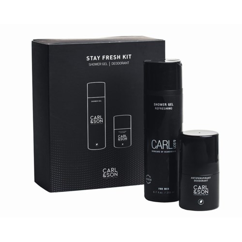 A black box containing men's grooming products: shower gel, deodorant, and aftershave.