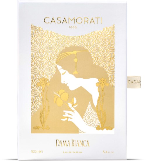 Een wit parfumdoosje met gouden kunstwerk van een vrouw die bloemen vasthoudt en de merknaam Casamorati, Dama Bianca.