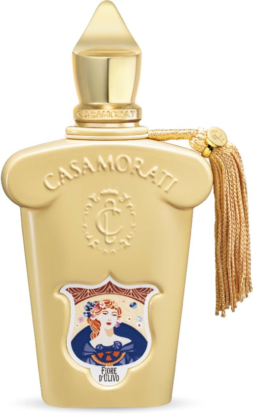 Een luxueuze parfumfles met gouden dop, kwast en een kleurig kunstlabel met een vrouw.