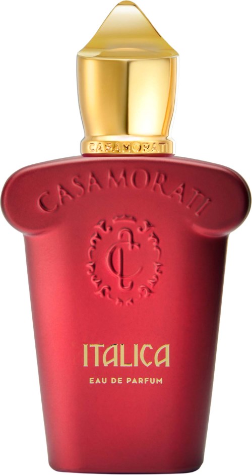 En rød parfymeflaske med gullhette, merket "ITALICA" og dekorert med embossing.