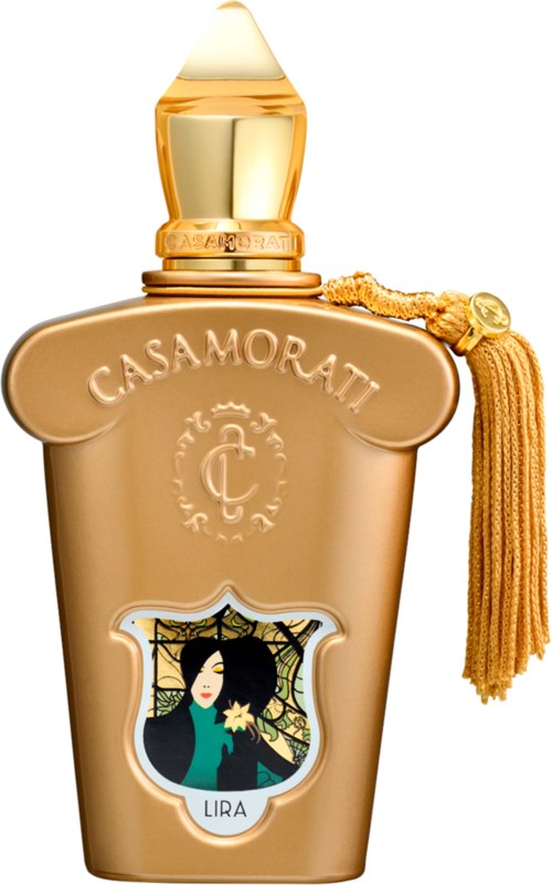 Złota butelka perfum z frędzelkiem, oznaczona Casamorati, z wizerunkiem kobiety i pajęczyny.