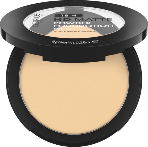 A compact, round beige powder foundation with a black lid, labeled with product details.