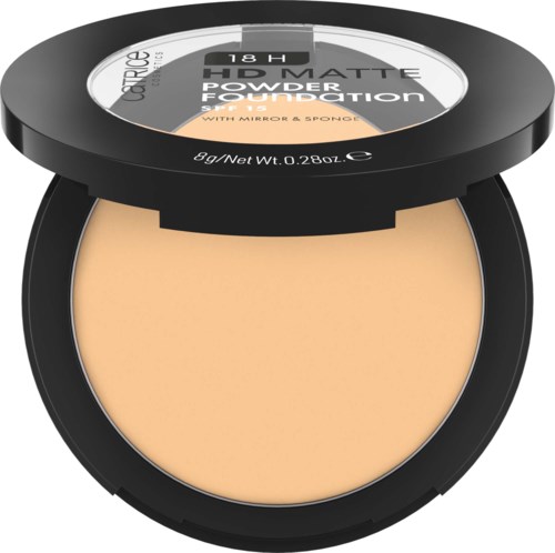 A compact makeup powder in a round black case with a clear lid displaying product details.