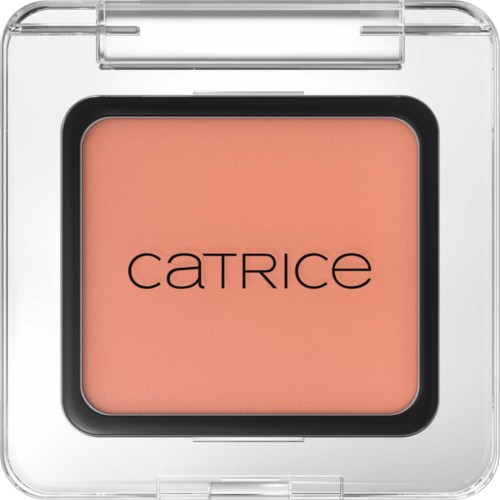 A compact blush in a clear plastic case with the brand name Catrice printed inside. The blush is peach-colored.