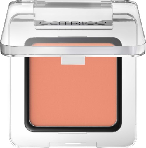 A compact peach-colored blush in a clear plastic case with a transparent lid labeled 'Catrice.'