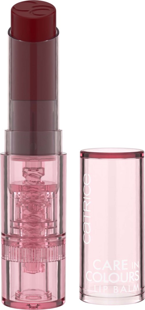 A pink lip balm tube with the cap removed, showing the red balm inside.