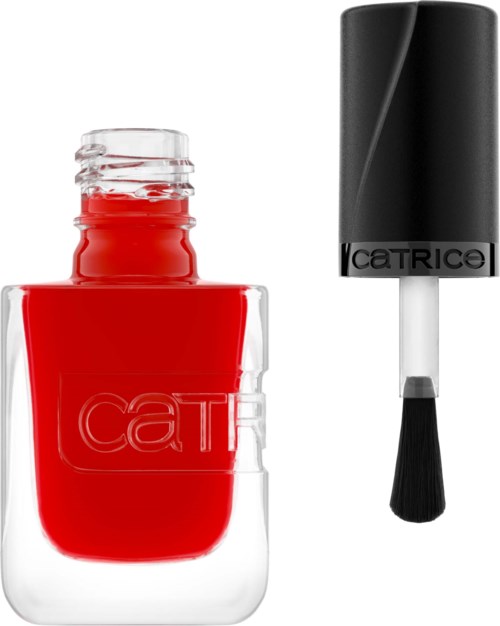 Red nail polish in a clear bottle with a black applicator brush nearby.