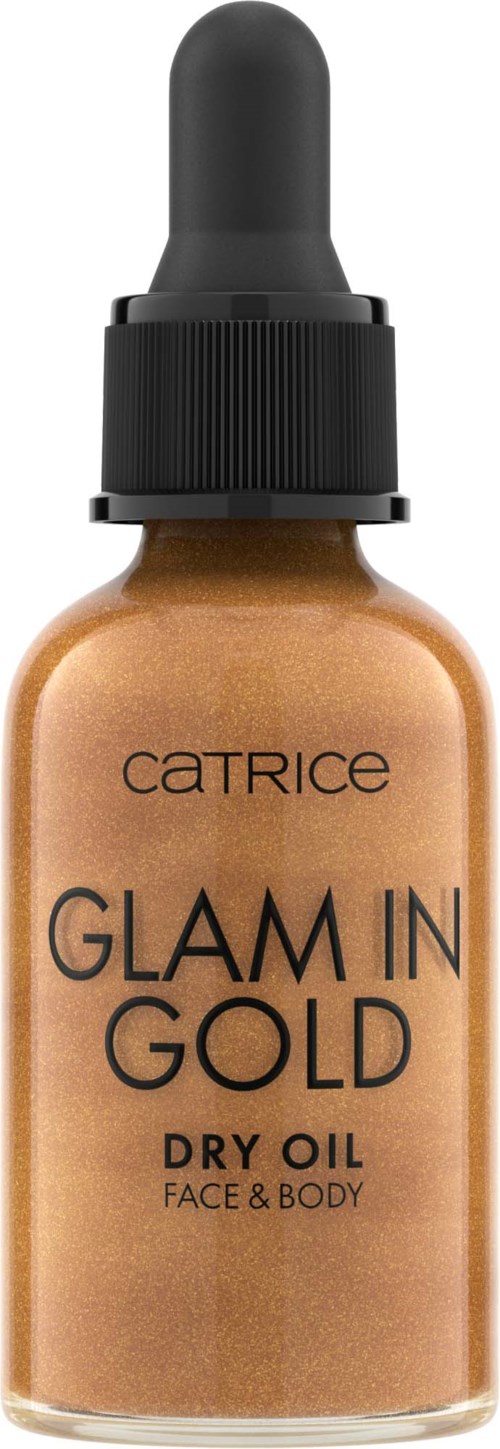 Pieni pullo tipurilla, merkinnällä Catrice Glam in Gold Dry Oil kasvoille ja vartalolle, pronssinvärinen.