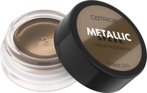 Small jar with beige cream eyeshadow labeled "Metallic Spark." Black lid placed beside the jar.