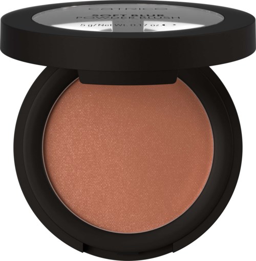 A round makeup compact with peach-colored powder inside and a black lid on top.