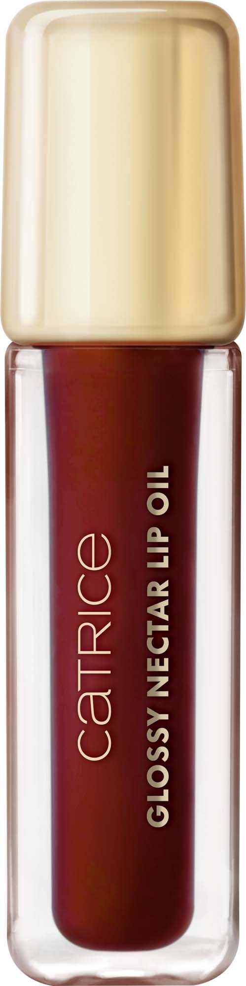 A tube of Catrice glossy nectar lip oil with a gold cap, filled with dark reddish lip gloss.