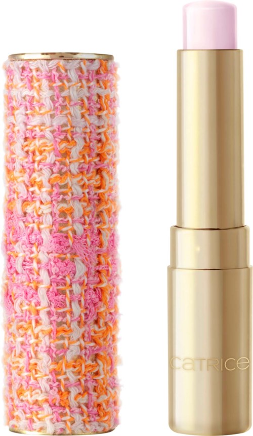 Een roze en oranje getextureerde cosmetica-container met een gouden lippenstift naast.