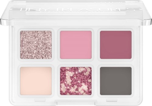A makeup palette with six eyeshadow colors: glittery pink, light pink, dark pink, light beige, purple flower pattern, and dark gray.