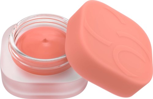 Pieni purkki pinkkiä kermaa ja samanvärinen kansi vieressä. Kansi on osittain pois, ja krema näkyy.