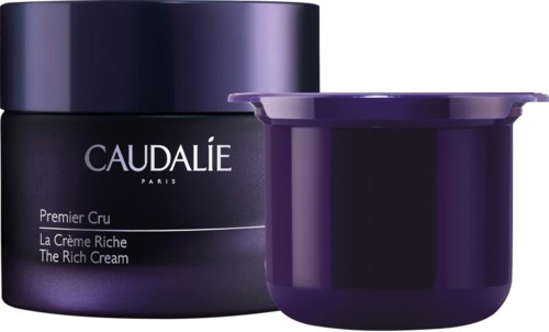 Tumman violetti säilykepurkki ja astiassa on nimi 'Caudalie' ja sanomaa rikkaasta voiteesta.