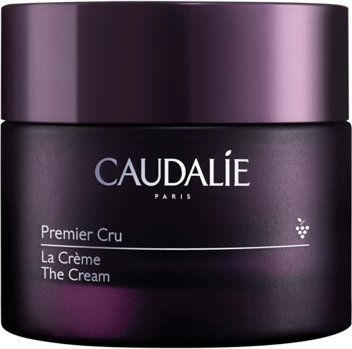 Tumma violetti purkki samettisella kansi, jossa lukee 'Caudalie Paris Premier Cru The Cream.'