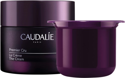 Tumma violetin värinen rasia, jossa irrotettava kansi, sisältää todennäköisesti ihonhoitovoiteen, merkinnällä 'Caudalie Paris'.
