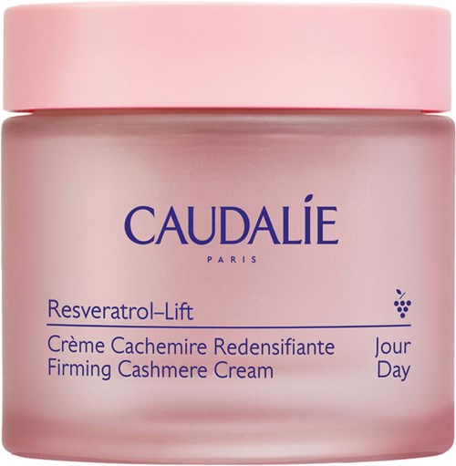 A pink jar with blue text, containing Caudalie Resveratrol-Lift firming cream for day use.