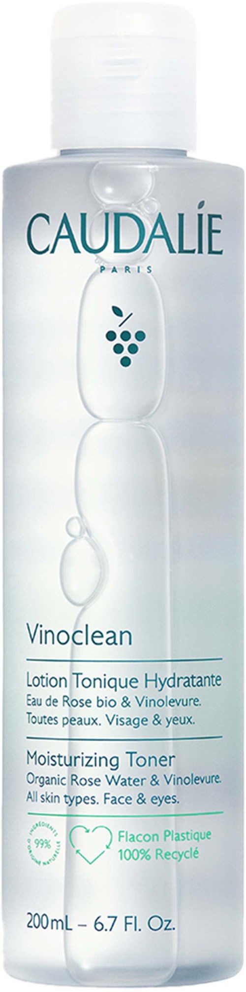 A clear bottle with white cap, labeled Caudalie Vinoclean face and eye moisturizer, containing rose water and vine leaves.