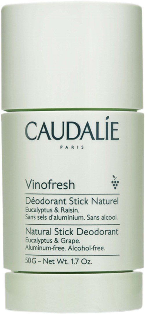En vit rullande deodorantbehållare med grön text och detaljer, märkt Caudalie Vinofresh naturligt deodorantstift.