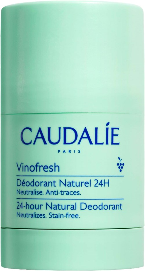 A green deodorant container with blue text, labeled 'Caudalie Vinofresh 24-hour natural deodorant.'