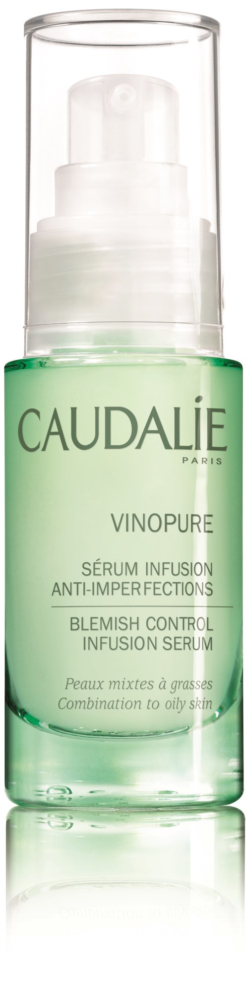 En grønn flaske med Caudalie Vinopure serum for urenheter med pumpedispenser.