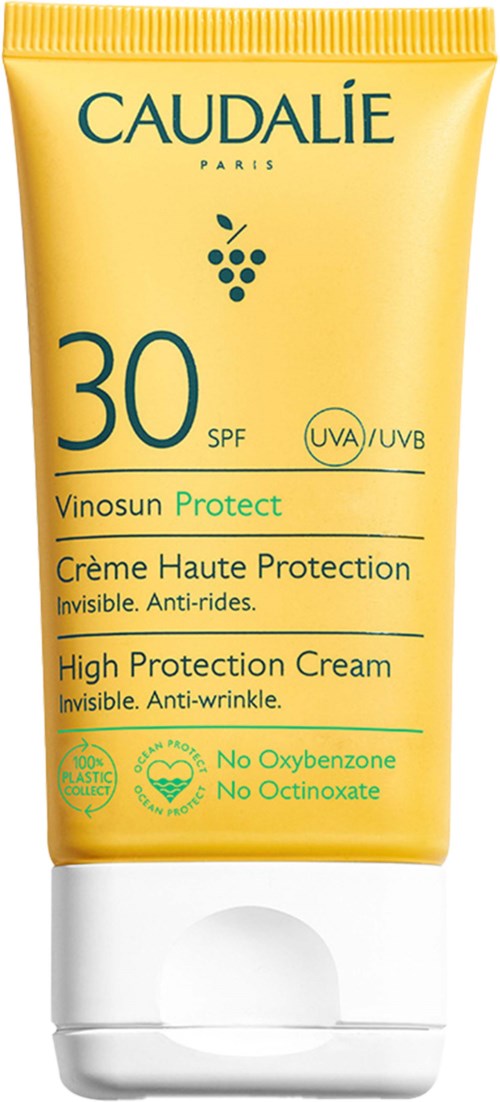 Keltainen putki sinisellä ja vihreällä tekstillä ihon suojaukseen, SPF 30, lukee 'Vinosun Protect' ja 'High Protection Cream.'