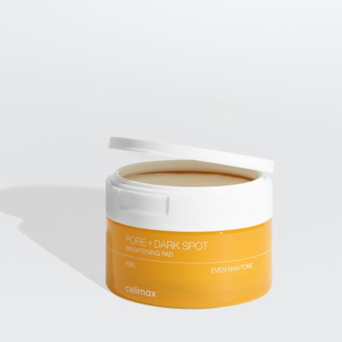 Ein gelber und weißer Behälter mit Hautpflegecreme für hellere, gleichmäßige Haut. Deckel offen, Produkt sichtbar.