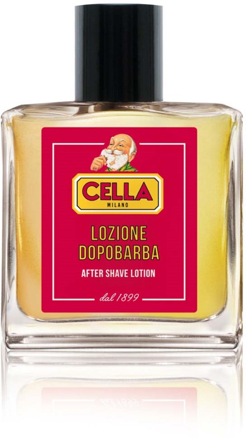 A clear bottle with yellow lotion, red and yellow label, Santa's face, and black cap.