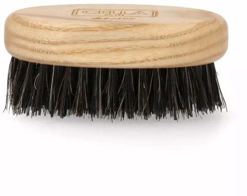 A wooden oval brush with black bristles and a logo on top.