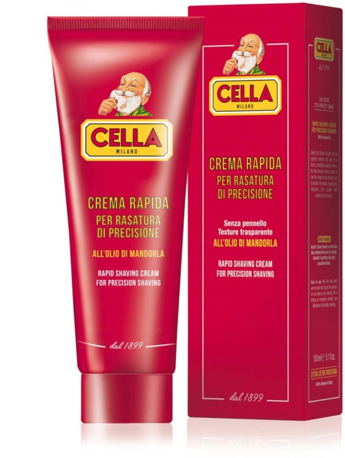 A red tube of rapid shaving cream with a cartoon man, alongside a matching red box with similar design and text.