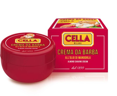 A red jar of almond shaving cream with yellow and red packaging box behind it. The box has a woman and a boy on top.