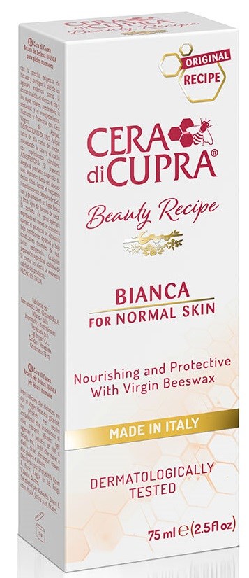 En lång, vit kartong med rosa och guld text och dekor, märkt som en hudvårdsprodukt med bivax, tillverkat i Italien.