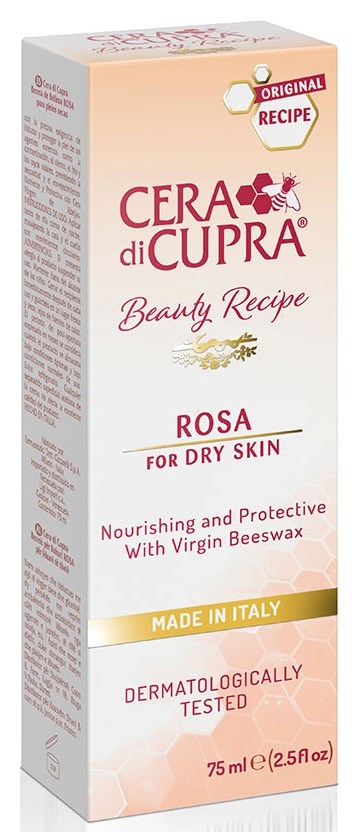 En lång, rektangulär kartong med rosa och persika färger, märkt för en hudvårdsprodukt för torr hud som är tillverkad i Italien.