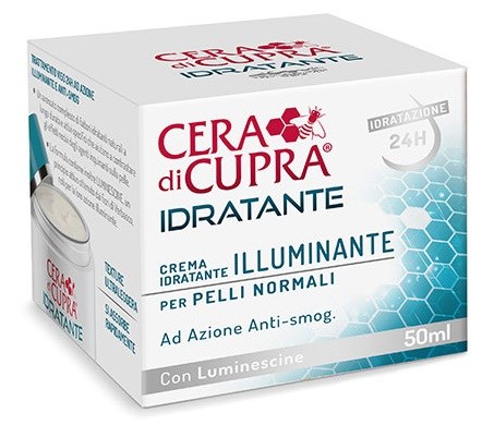 En liten vit låda med etiketten 'Cera di Cupra Idratante Illuminante' för normal hud, med en blå honungskakeliknande design och silverlock.