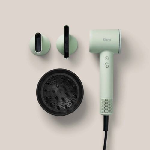 A set of headphones with two ear pieces, a round base, and a hairdryer, all in light green color.