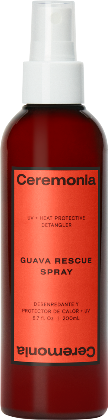 Punainen sumutepullo merkintä 'Ceremonia Guava Rescue Spray', käytetään lämpösuojana, selvitykseen ja UV-suojaksi.