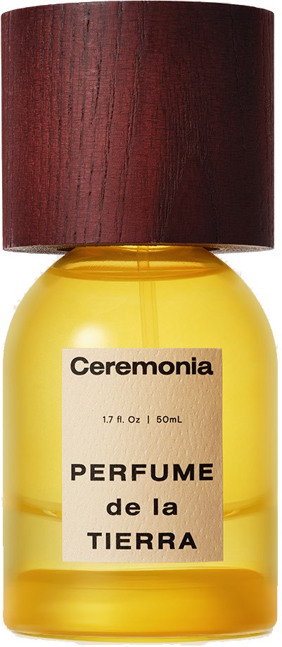Keltainen hajuvesipullo, jossa tummanruskea korkki ja etiketti 'Ceremonia' ja 'Perfume de la Tierra.'